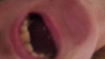 Woman spreads her mouth in a close up video