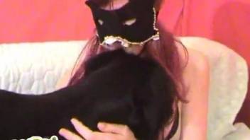 Masked zoophile stroking a dog's delicious boner